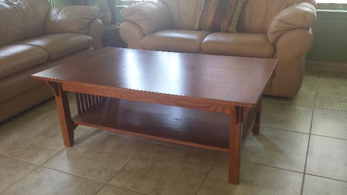 Oak coffee table, converts to table height for serving.  $75.00