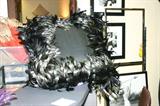 Black feather Diva pillow from Judge Cribs guest bedroom.