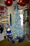 Judge Cribs blue tree with blue lights, purchase this tree and recieve all the ornments on the tree for free.