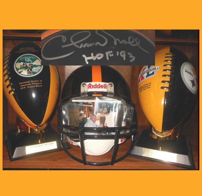 Sample of the Pittsburgh Steelers Collectibles available including a Chuck Noll Signed Helmet complete with Photo of Chuck Noll doing the signing.  More Steelers Photos below. 