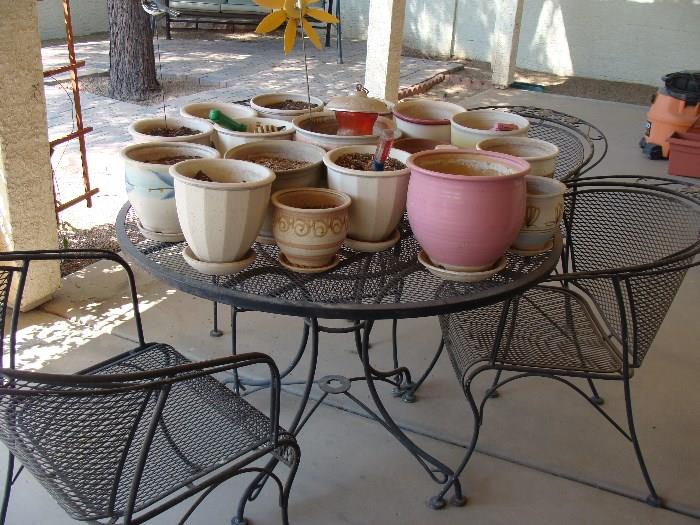 patio furniture and lot of pottery