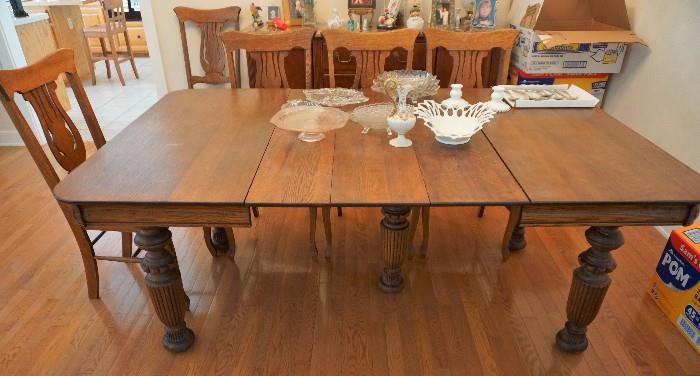 Antique table and 12 chairs. There are 7 leaves for the table!
