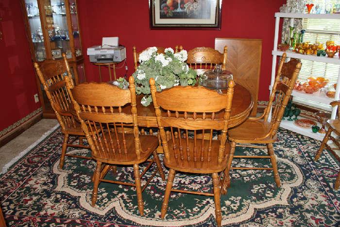 Oak Table, 1 leaf, and 8 pressed back chairs