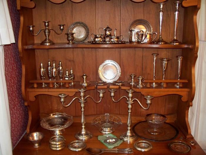 Some of the Many Pieces of Sterling Silver.  Candlesticks, Vases, Coaster, Butter Pats, Bowls, Tea Set, Salt and Peppers, and Flatware.