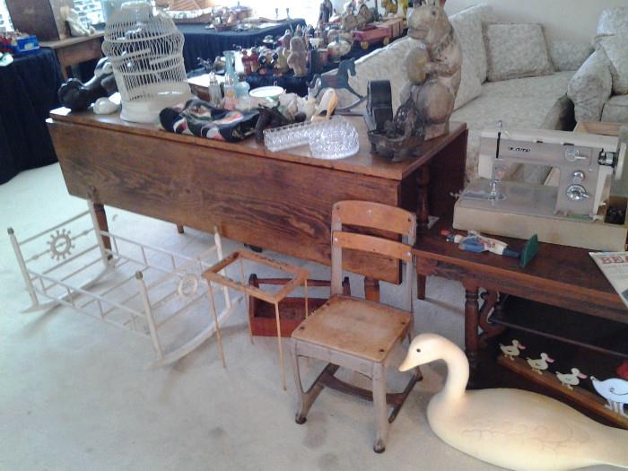 Table with fold down leaves on each side, vintage school chair