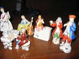 Occupied Japan Figurines (7) Piano, Piano Player, Flute Player, Mandolin Player, Cello Player, & Guitar Player.