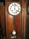 Close Up of Face of 1960's German Hand Carved, Wind Up Clock, w/Pendulum. 38' Tall