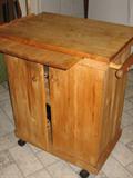 pine kitchen island with wheels, knife holder, pullout tray and two doors
