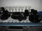 black dishes and black stem glasses
