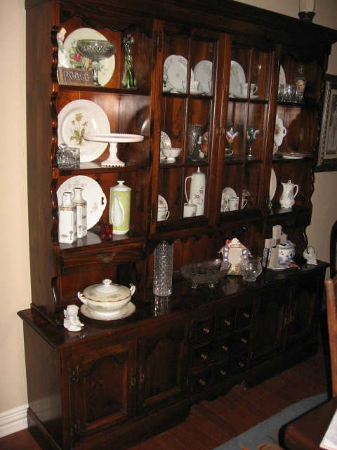 Two piece pine china cabinet. Top has two glass  doors, and two drawers. Bottom has four doors, three drawers. 74 inches long, 81 inches tall, 16 inches deep.
