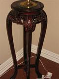 Wood plant stand with marble insert in top. 36 inches tall, 15 inches across.