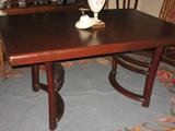 Wood dining table with three leaves. Each leaf 12 inches wide. 60 inches long, without leaves, 42 inches wide.