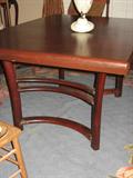Wood dining table with three leaves. Each leaf 12 inches wide. 60 inches long, without leaves, 42 inches wide.