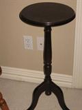 Round plant stand. 28 inches tall, 14 inches across.