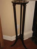 Pair of round plant stands. Levin inches across, 40 inches tall.