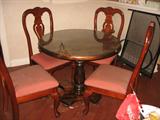 Oval Pine breakfast table with glass top four matching chairs. 36 inches across, 30 inches tall