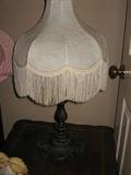 metal base lamp with fringe shade