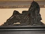 mantelpiece depicting child asleep on fainting couch with umbrella