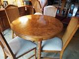Round dining room table. One extender and six chairs