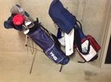 2 sets of golf clubs