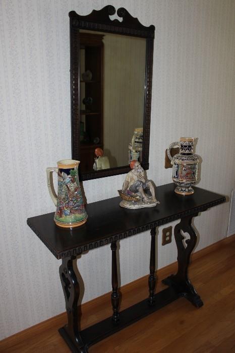 Antique entry table and matching mirror. Capodimonte figure. Stein jugs.