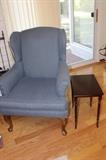 Classic wing back chair and one of three nesting tables.