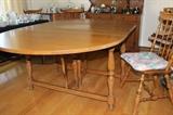 Maple gate leg table with five chairs.