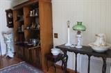 Wash bowl and jug, marble lamp, antique tables. Double book case with hardbacks and vintage barware.