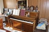 Wurlitzer piano and bench, Asian lamps and mantle clocks.