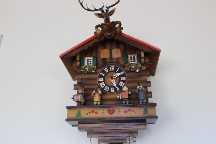 German cuckoo clock with cuckoo and oom pah band.