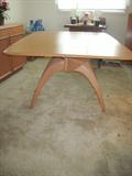 Hayward-Wakefield Dining room set. Table with 3 sets of arched legs.