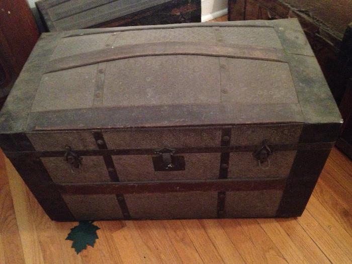 Humpback Victorian trunk with pressed metal and wood