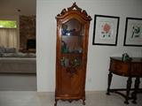 One of a pair of French style carved vitrine cabinets