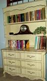 Vintage dresser with books and Sessions mantle clock.