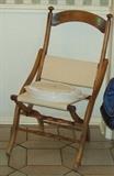 Interesting old folding chair.
