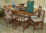 Kitchen table with 4 chairs and a bench.