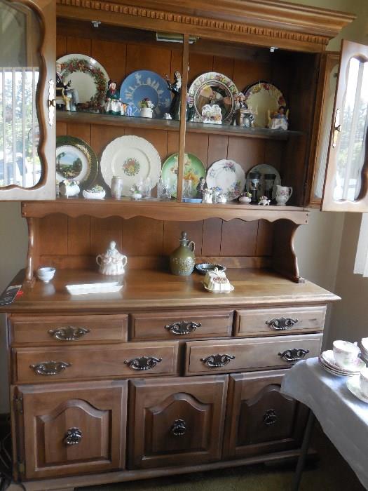 Breakfront cabinet. Many royal Doultons and Aynsley porcelain flowers.