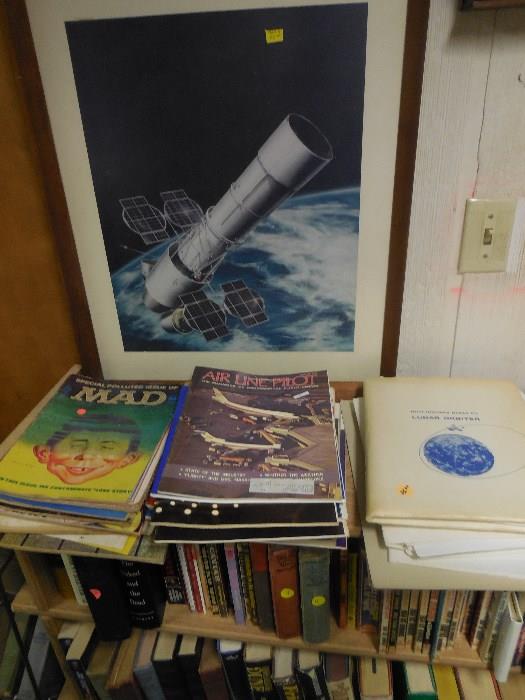 many books, magazines of Pearl harbor and airline. Large Lunar space photo.