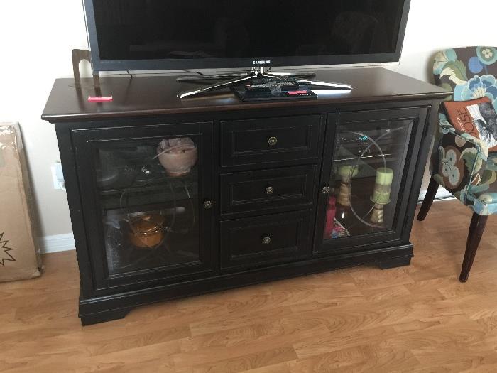 Flatscreen TV stand. Holds DVD player etc or use it as a buffett
