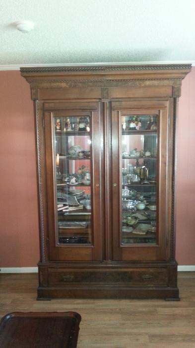 1870's Wardrobe Converted into a China Cabinet given to Lara Moreno Fordham by her Father Don Fransisco Moreno.  It has a crest but wont fit with the low ceiling.