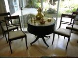 The Four Side chairs were sold, but we still have the Leather-Top Drum Table