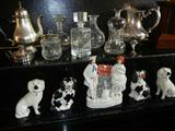 A Pair of Staffordshire Dogs, a selection of Crystal Decanters, and a Silverplate Pitcher from the Collection of the Rothschild Family.