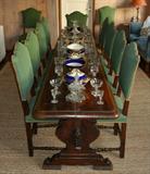 18th. C. Italian Baroque Walnut Refectory Table, 10' 10" long x 2' wide w/ 10 (set of 12) Baroque Scalloped-Back Dining Chairs.
Antique Bavarian Porcelain Serving Pieces and Antique Cut Crystal Condiment Jars.