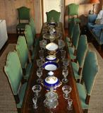 18th. C. Italian Baroque Walnut Refectory Table, 10' 10" long x 2' wide w/ 10 (set of 12) Baroque Scalloped-Back Dining Chairs.
Antique Bavarian Porcelain Serving Pieces and Antique Cut Crystal Condiment Jars.