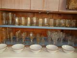Over 70 pieces of Antique Gold-Decorated Glasses & Stemware w/ a set of Limoges Consomme Bowls and Cut Crystal Stemware.