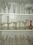 Top shelf:  Antique Stemware, etched on left, Venetian on right;   Middle shelf:  All Antique Venetian Glass;   Bottom Shelf:  All Etched Antique Cordials, many w/ the Family Crest.