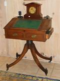 An Antique Duncan-Phyfe-Style Oak Pedestal Table w/ and antique Chiming Mantle Clock.