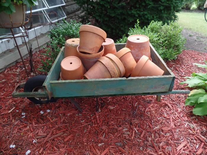 Wood wheel barrel with clay pots