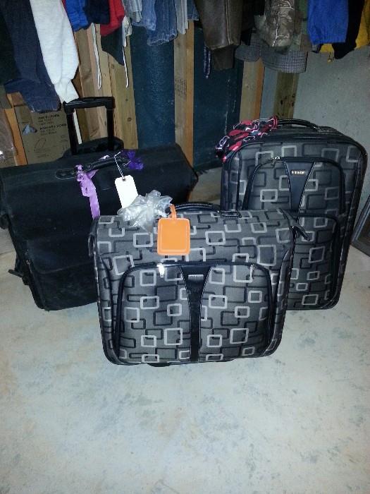 several pieces of like new luggage