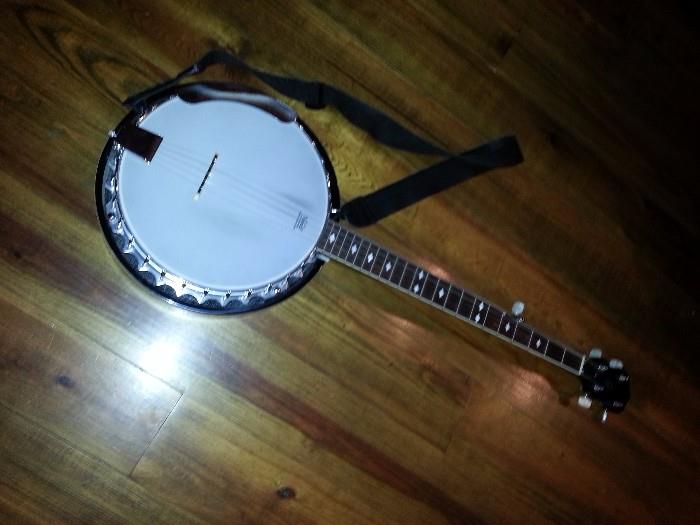 Stagg beginners Banjo with a case and a stand